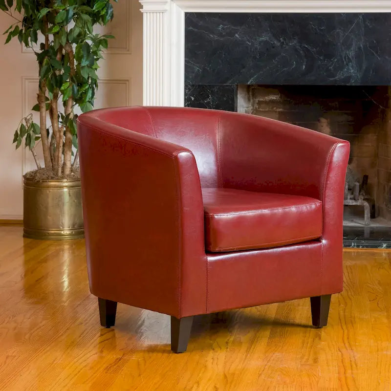 Clubfauteuil met kuipvormige zitting van gebonden leer in ossenbloedrood van Christopher Knight Home