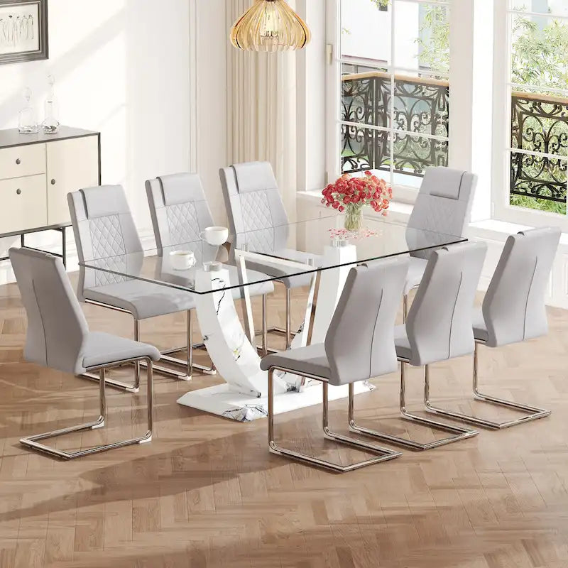 Ensemble de table à manger moderne en verre trempé avec piètement en U à motif marbré et chaises rembourrées de similicuir