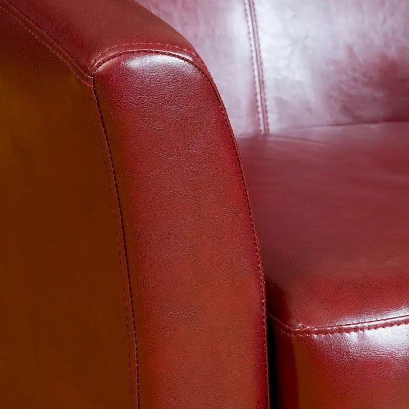 Clubfauteuil met kuipvormige zitting van gebonden leer in ossenbloedrood van Christopher Knight Home