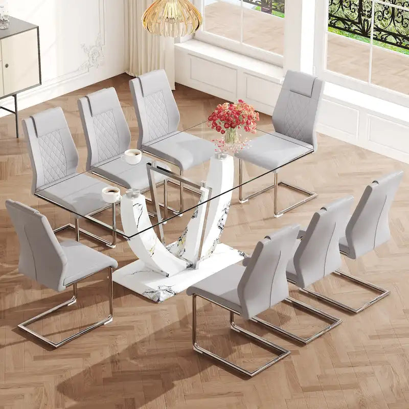 Ensemble de table à manger moderne en verre trempé avec piètement en U à motif marbré et chaises rembourrées de similicuir