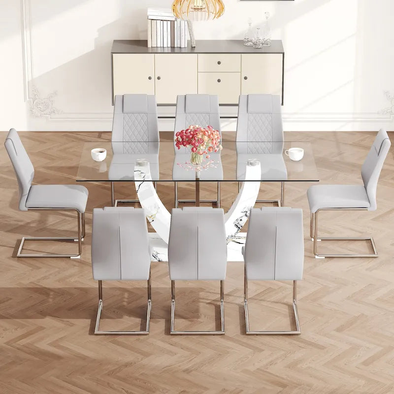 Ensemble de table à manger moderne en verre trempé avec piètement en U à motif marbré et chaises rembourrées de similicuir