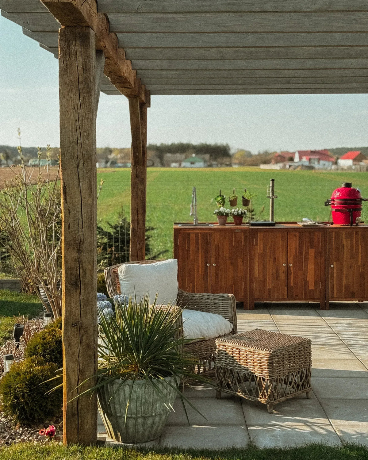 Tuinstoel met voetensteun van natuurlijk rotan