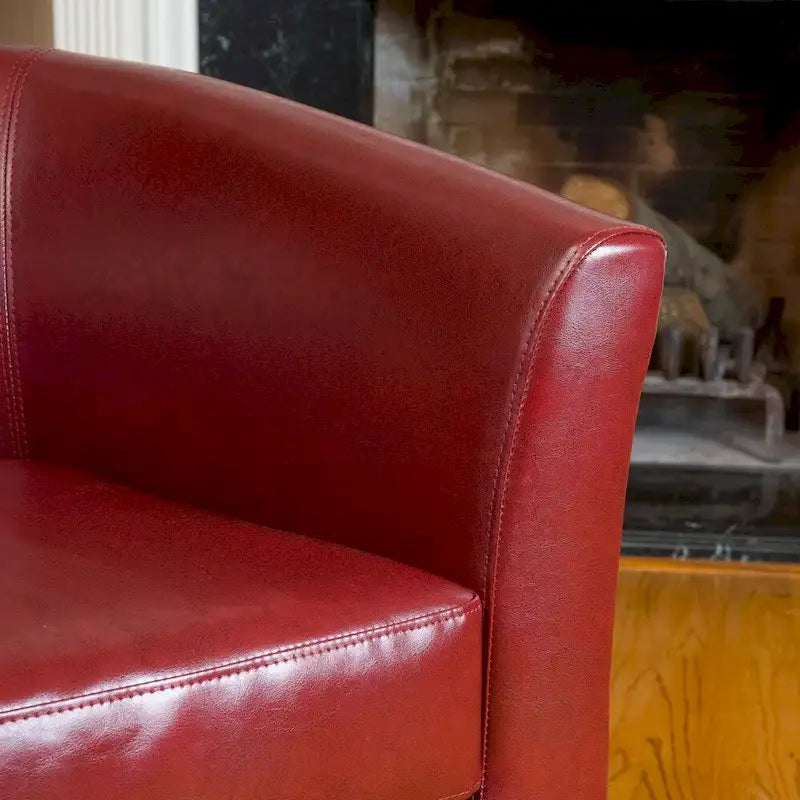 Clubfauteuil met kuipvormige zitting van gebonden leer in ossenbloedrood van Christopher Knight Home