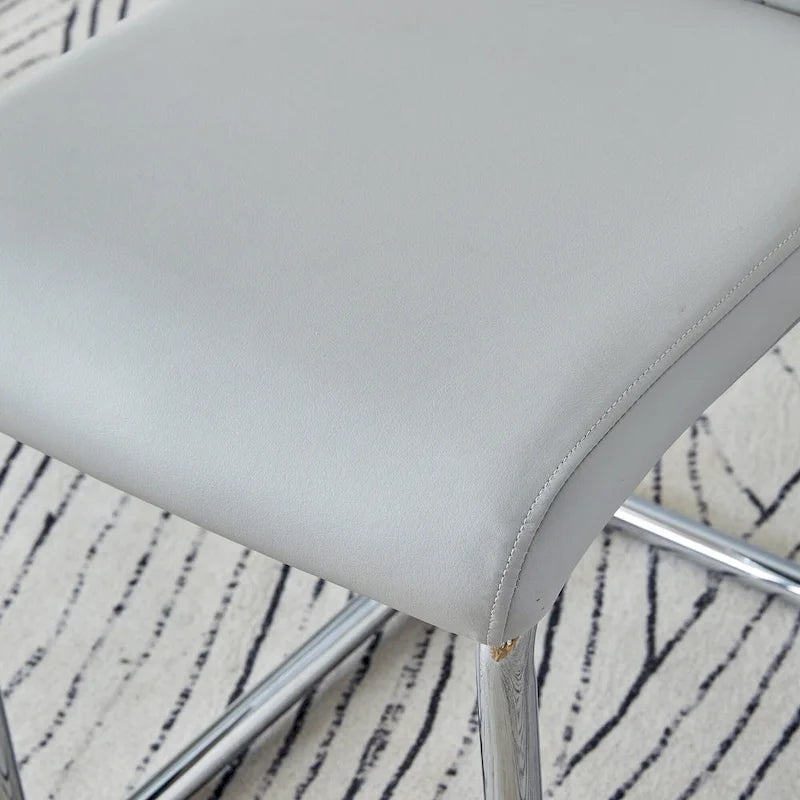 Ensemble de table à manger moderne en verre trempé avec piètement en U à motif marbré et chaises rembourrées de similicuir